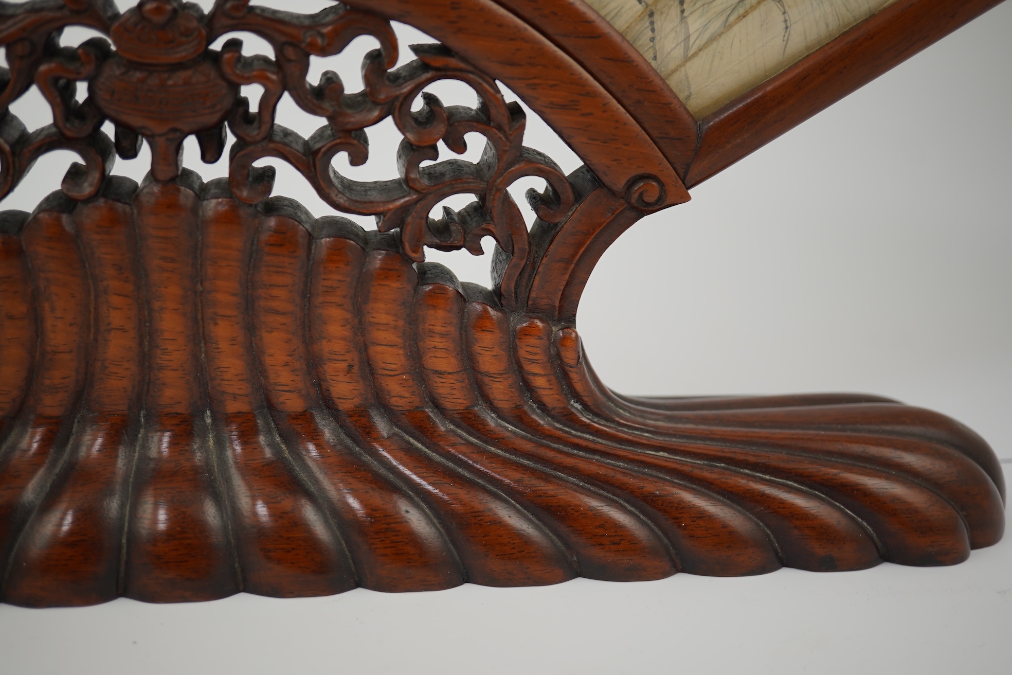 A Chinese painted leaf fan and hardwood stand, late 19th century